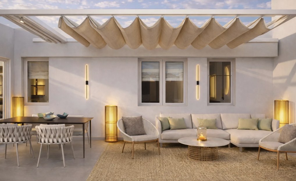 Render of the Castillo 20 terrace with sofa, dining table and shade sail