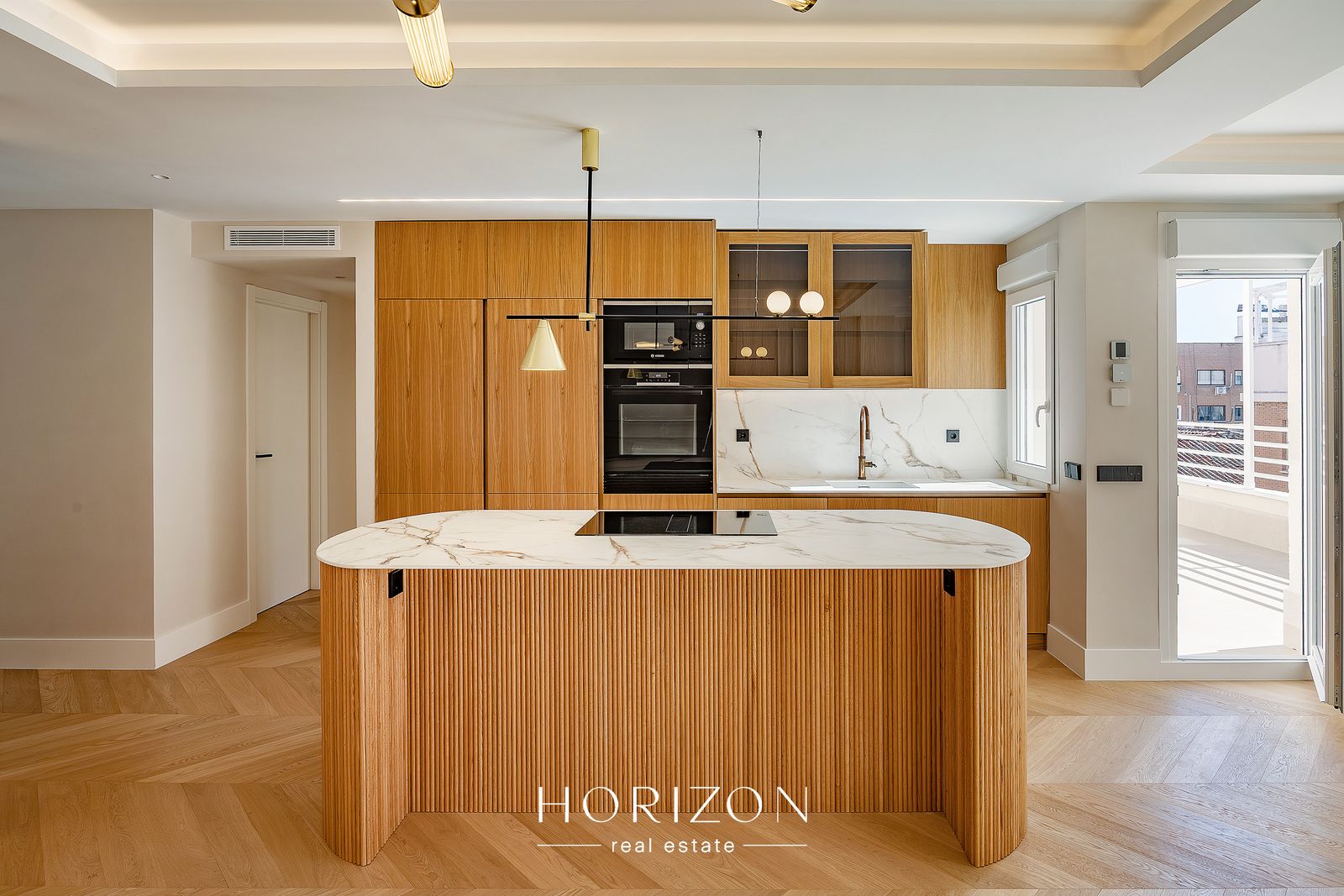 Oak kitchen with fluted island after renovation