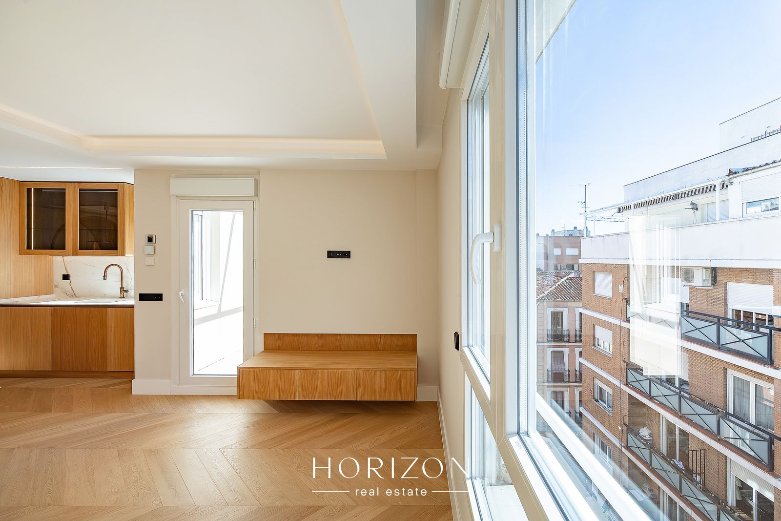 Living room with balcony door and built-in bench