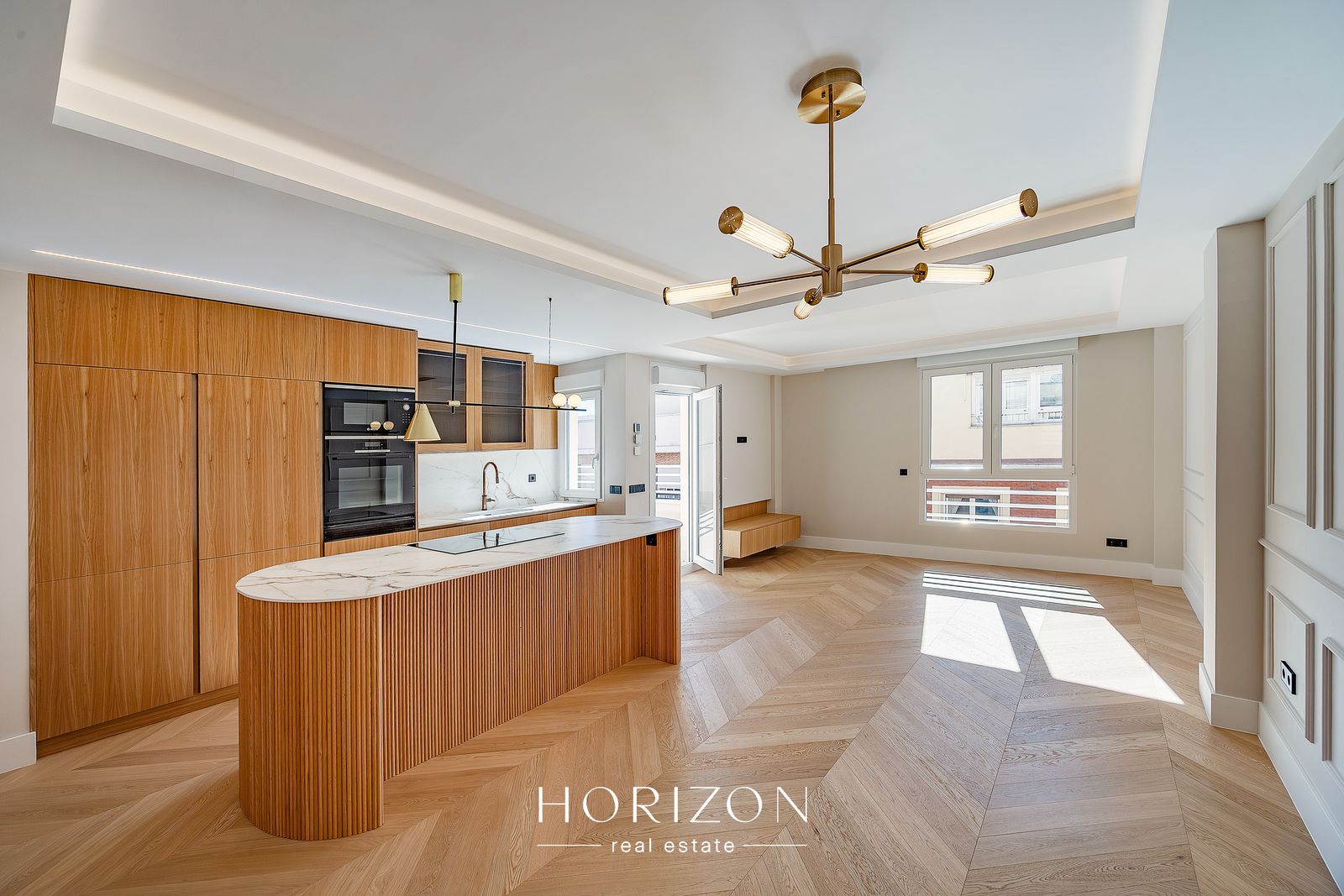 Open-plan living room and kitchen after renovation