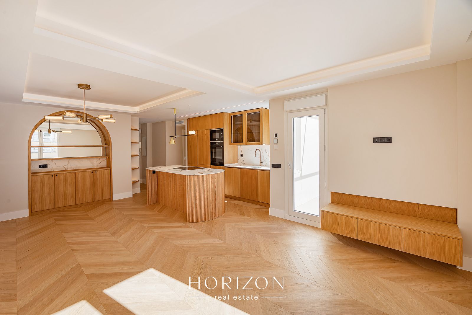 Open-plan living area with herringbone oak floor