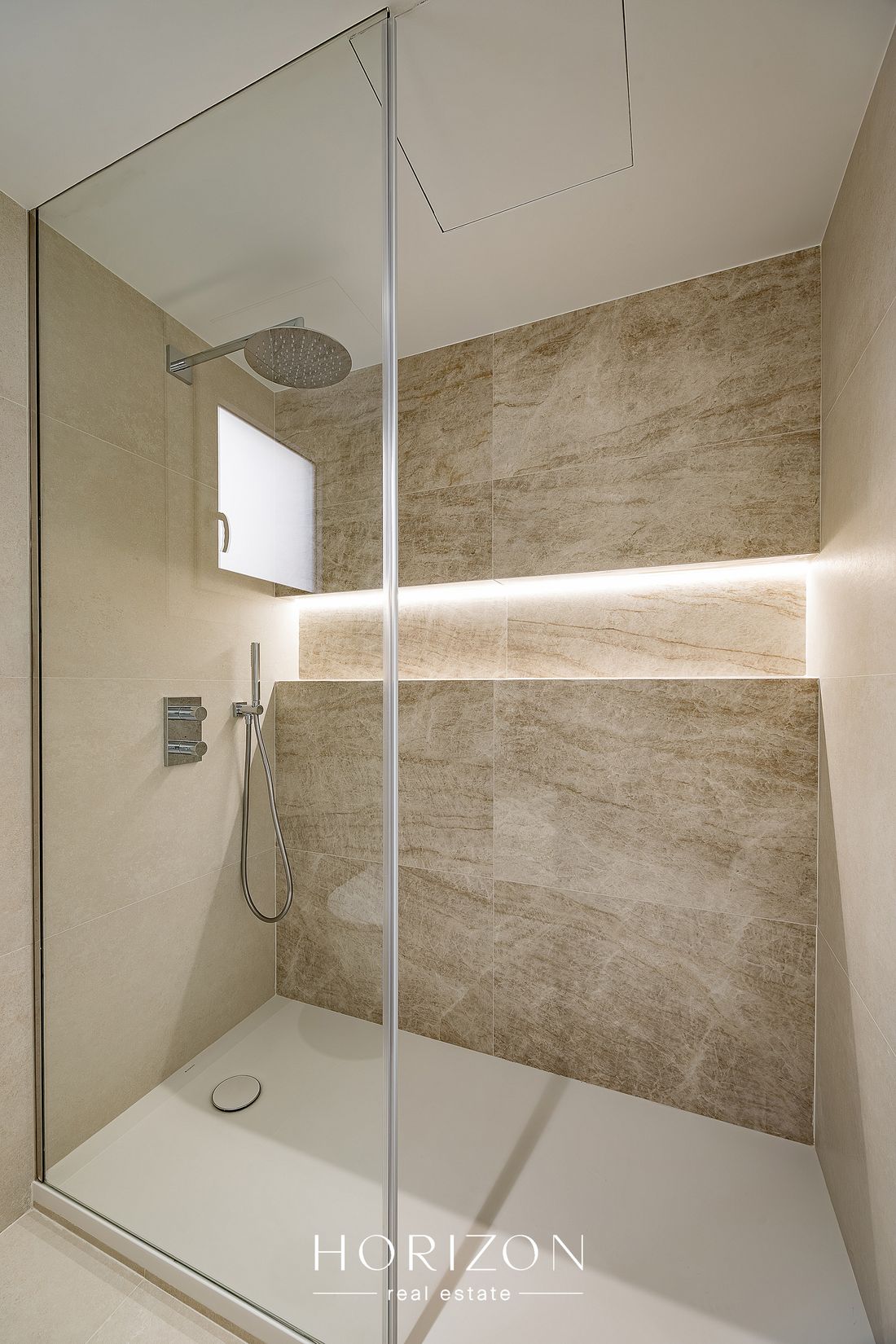 Walk-in shower with backlit niche