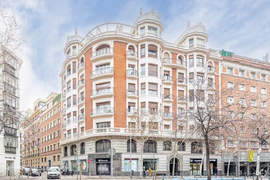 The classic corner building at Calle Sagasta 11 with its turrets and balconies
