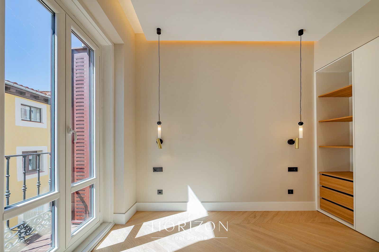Bedroom with pendant lights and built-in wardrobe
