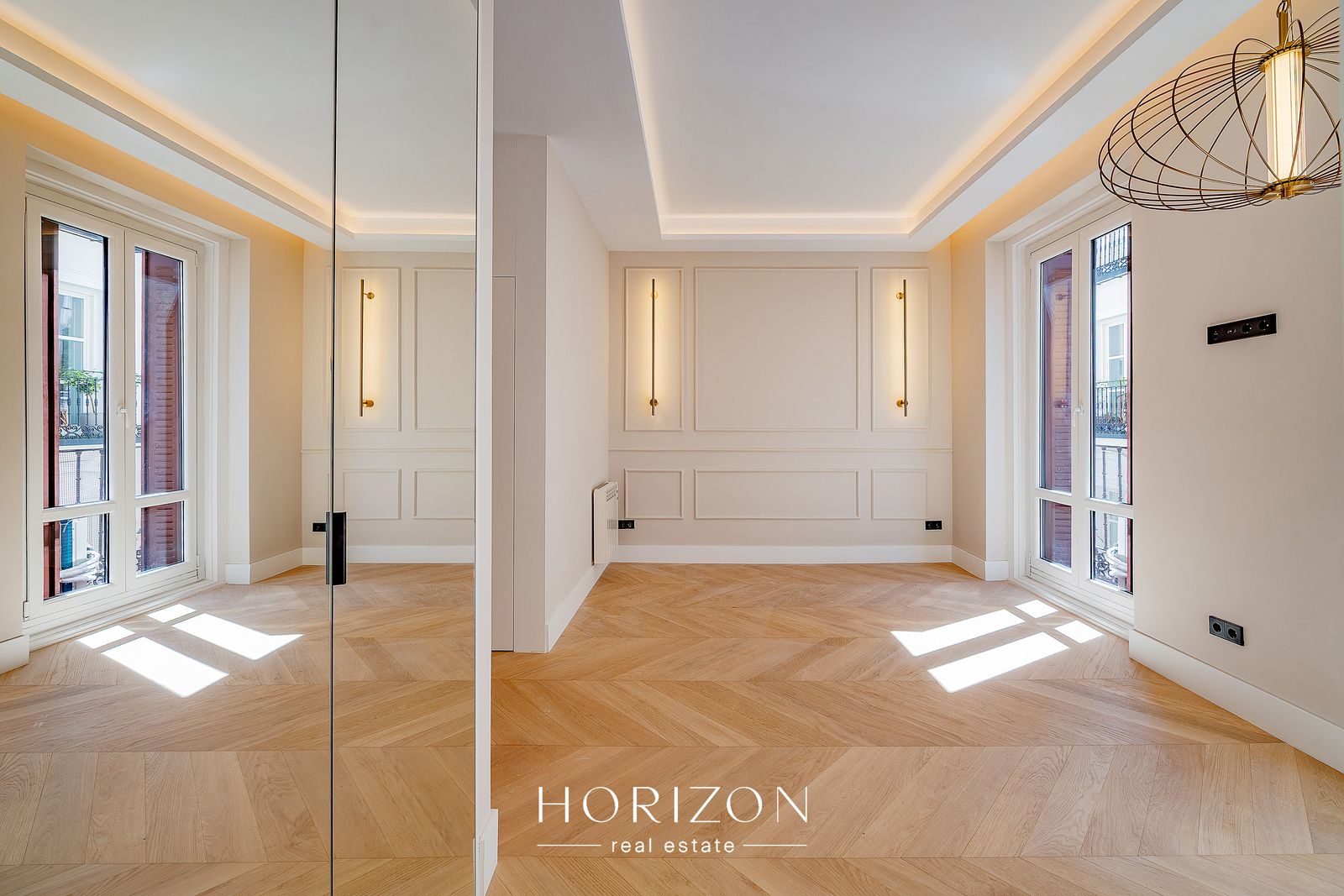 Living room reflected in the mirrored wardrobe